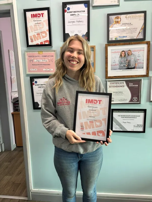 Abbie holding an imdt certificate