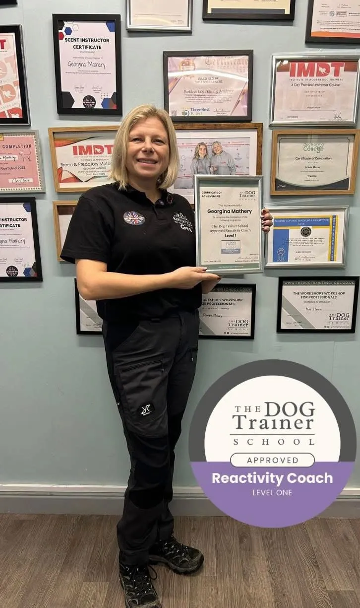 gee holding the dog trainer school certificate